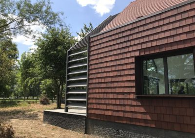 Maison bioclimatique bardage tuile plate et acier corten l Keteland Architecteurs